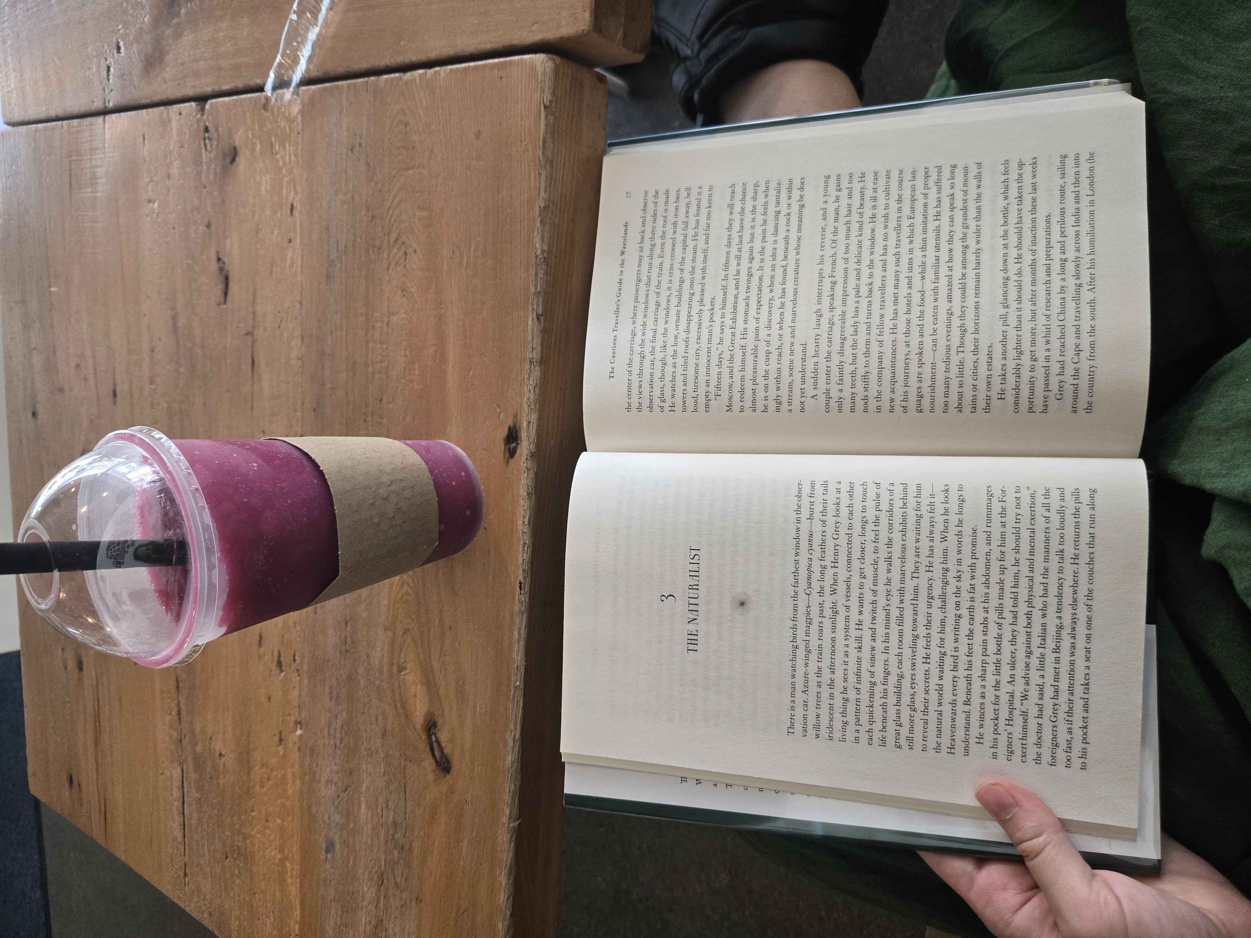 me reading chapter 3 in a cafe with a raspberry shake