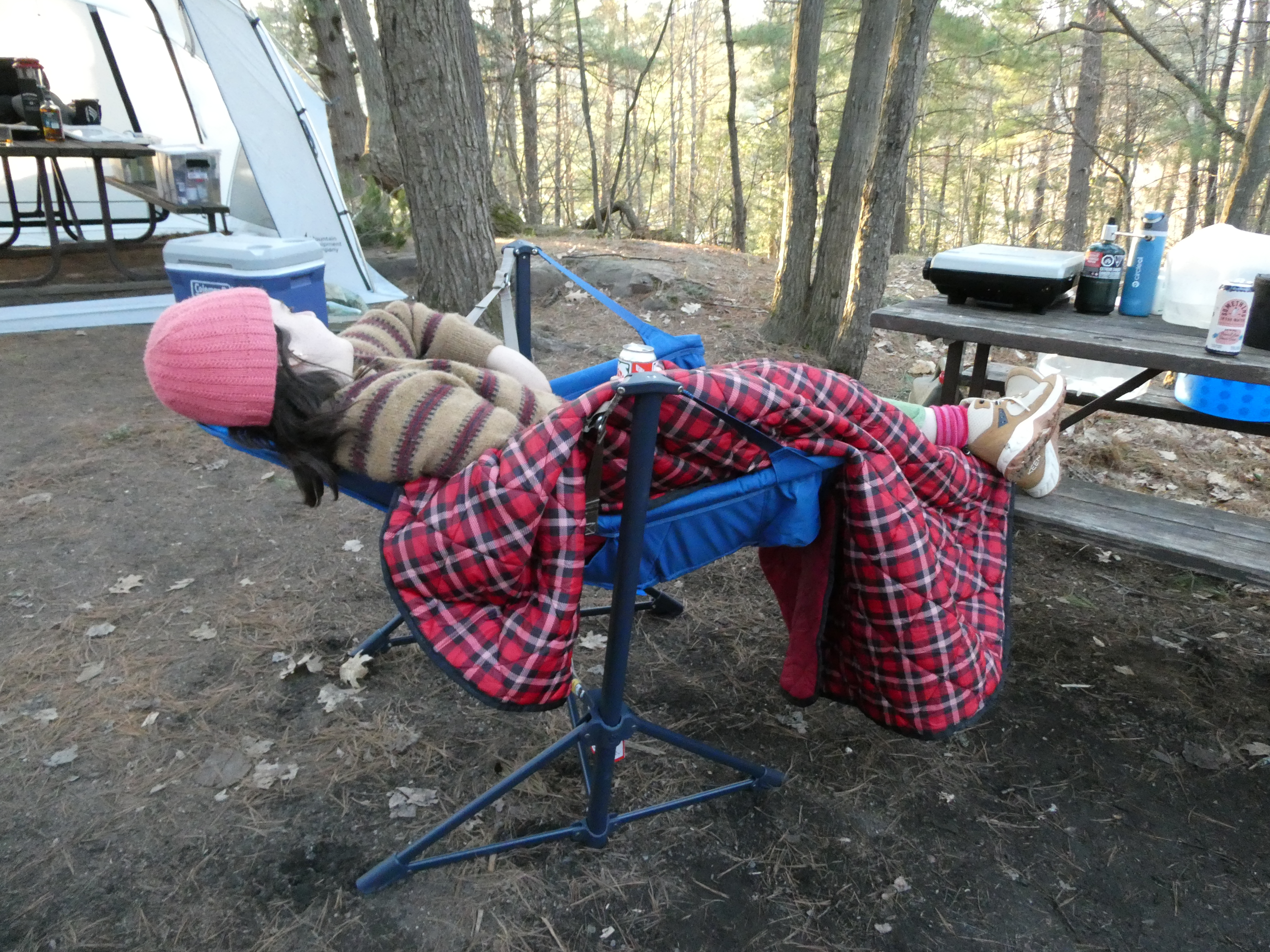 me reclining in my chair with a blanket at our campsite
