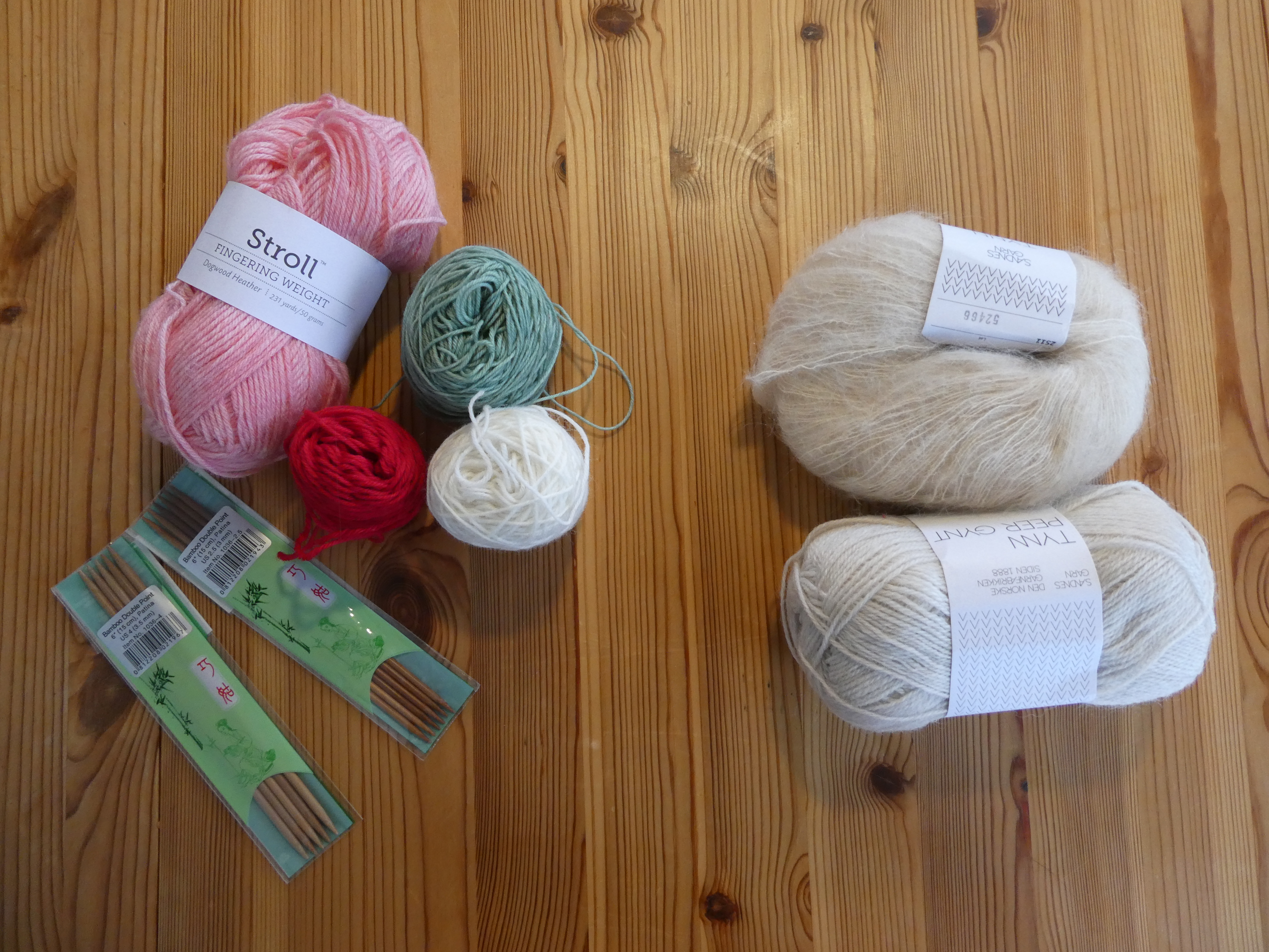 various balls of yarn and needles