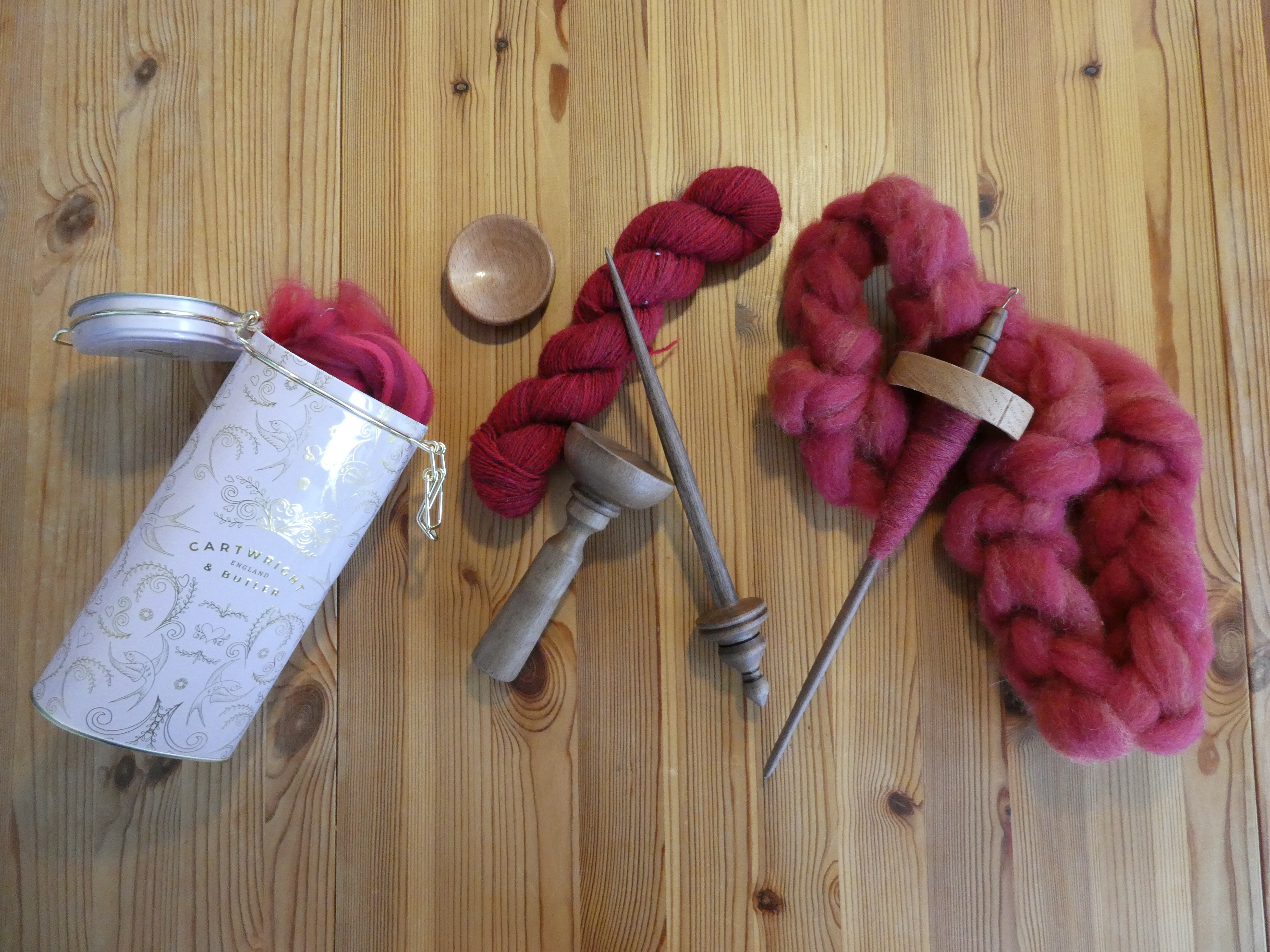 various amount of red/pink fibre and two different spindles